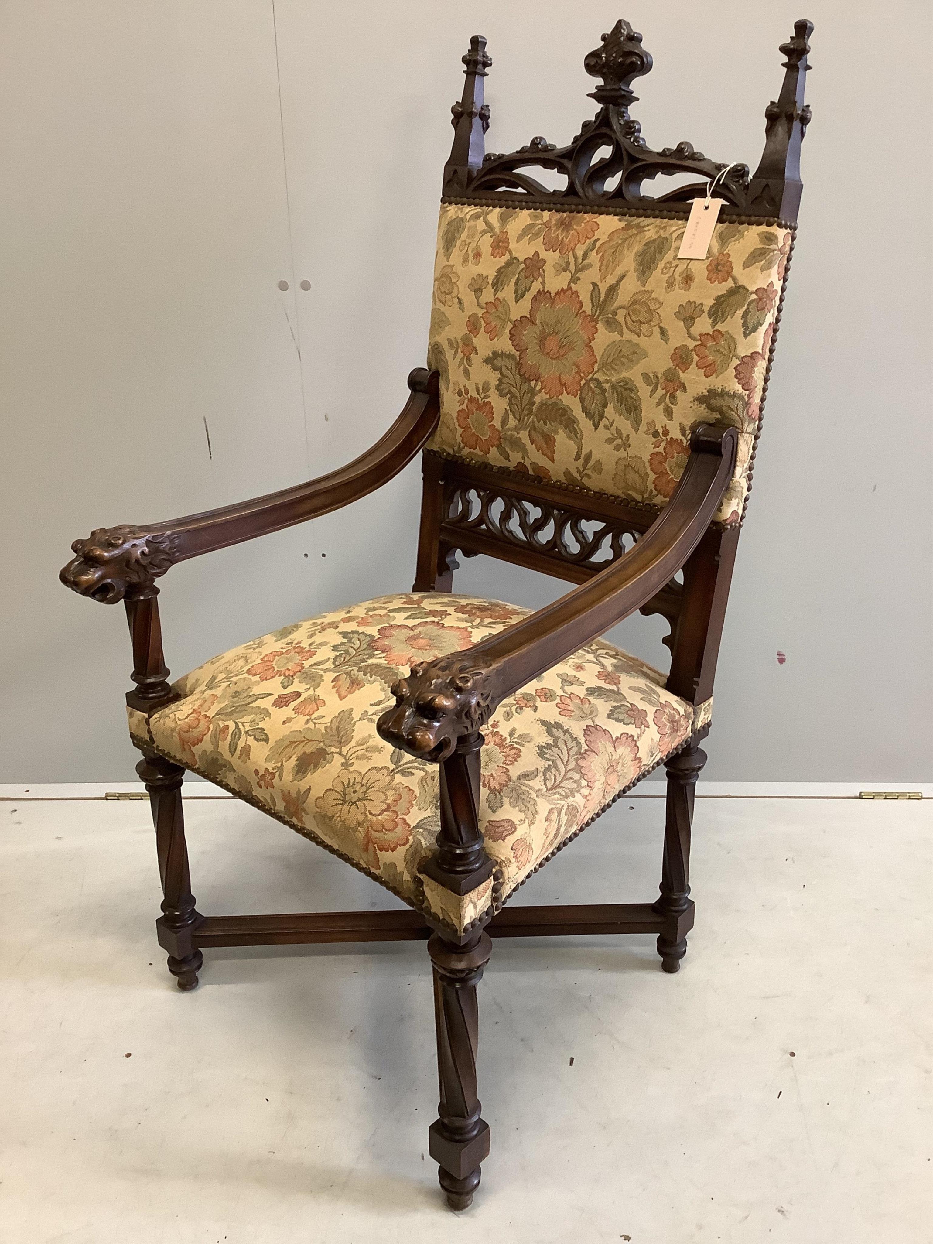 A neo-Gothic carved carved walnut chair, width 60cm, depth 60cm, height 122cm. Condition - fair to good